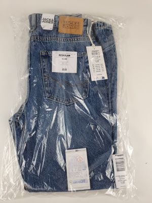 a close up of a pair of jeans wrapped in plastic