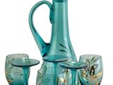 a teal colored glass decanter set with four wine glasses