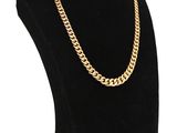 a black mannequin with a gold chain on it
