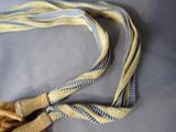 a yellow and blue tie that is on a table