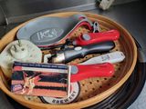 a basket full of tools sitting on a counter