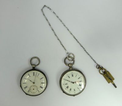 three different types of pocket watches on a white surface