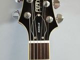 a guitar that is hanging on the wall