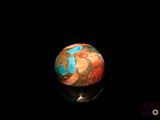 an image of a marble ball on a black surface
