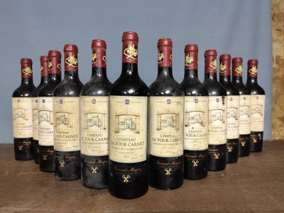 several bottles of wine are lined up in a row on a table
