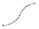 a multicolored bracelet with pearls and a gold clasp
