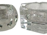 a glass candle holder and a glass candle holder on a white background