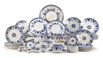 a large group of blue and white plates and bowls