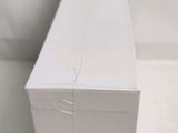 a white box sitting on a table with a white background