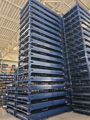several pallets stacked up in a warehouse with a ceiling in the background
