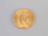 an image of a close up of a gold coin on a white surface