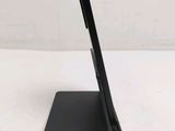 a close up of a tablet computer on a stand on a white surface