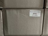 several boxes are stacked on top of each other in a warehouse