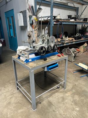 a machine that is sitting on a table in a garage