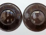 two plates that are sitting on a table