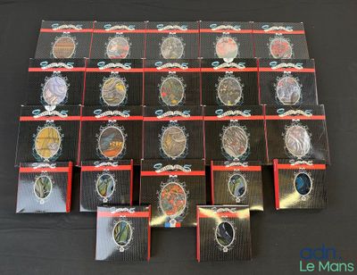 a lot of badges on a black table top