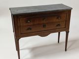 a small wooden table with a marble top on it