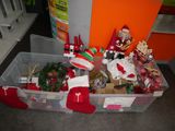 many christmas decorations in the bins on the floor