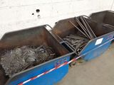 two blue bins filled with metal items in a garage