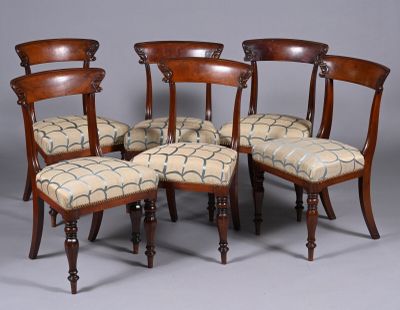 four chairs with upholstered backs and a patterned upholstered seat
