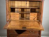 an old wooden desk with drawers and drawers on it