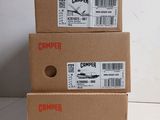 three cardboard boxes are stacked on top of each other on a table
