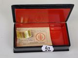 a small box with a ticket and a ticket in it