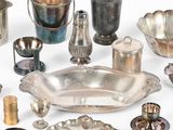 a lot of silver items that are on the table