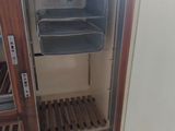 a small oven with a door open in a kitchen