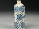blue and white vase with a floral design on the outside