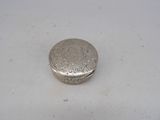 a silver box sitting on a white surface