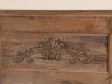 an old wooden door with a decorative design on it