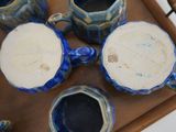 a tray with a tray of blue and white pottery on it