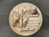 a plate with a musical theme on it on a table