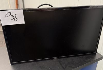 a black television sitting on top of a black table