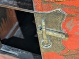 a close up of a wooden cabinet with a lock on it