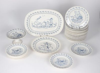 a lot of plates and bowls that are sitting on a table