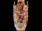 a vase that is sitting on a stand on a black background