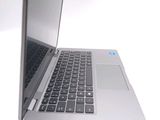 a close up of a laptop computer on a white surface