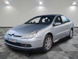 a picture of a silver car parked in a garage