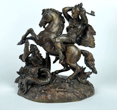 bronze statue of a man on a horse with a man on a horse