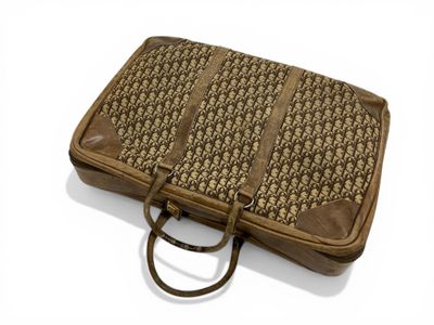 CHRISTIAN DIOR, vers 1970. Valise souple en toile oblique co…