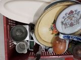 a red basket filled with dishes and bowls