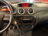 a dashboard of a car with a digital clock on it