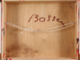 a wooden box with a string and a word written on it