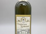 une bouteille de vin du Château Simon sur fond blanc