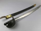 pair of two swords on a white surface with a black handle