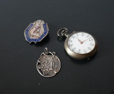 three different types of pocket watches are displayed on a black surface