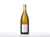 a bottle of white wine sitting on top of a table