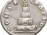 an old silver coin with a cake on top of it